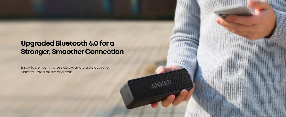 Text reads 'Upgraded Bluetooth 4.0 for a Stronger, smoother Connection'. Shows hands holding a black electronic device against grey sweater background.